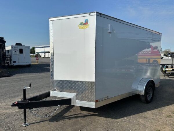 2025-COVERED-WAGON-7X12-ENCLOSED-CARGO-TRAILER-RAMP-DOOR-V-NOSE-1.jpg Covered Wagon 7’x12′ Enclosed Trailer — 6″ Added Height