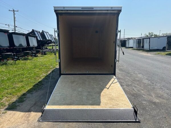 2025-COVERED-WAGON-7X16-ENCLOSED-CARGO-TRAILER-SPOILER-RAMP-DOOR-1.jpg Covered Wagon 7 x 16 Enclosed Trailer – 18″ Added Height