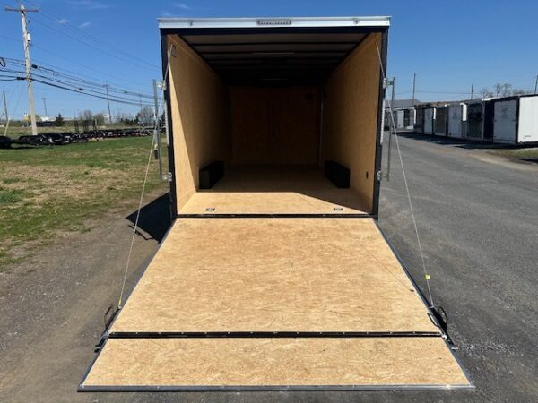 2025-COVERED-WAGON-8.5X20-ENCLOSED-CAR-HAULER-RAMP-DOOR-6.jpg Covered Wagon 8.5 x 20 V-Nose Enclosed Car Trailer – 6″ Added Height