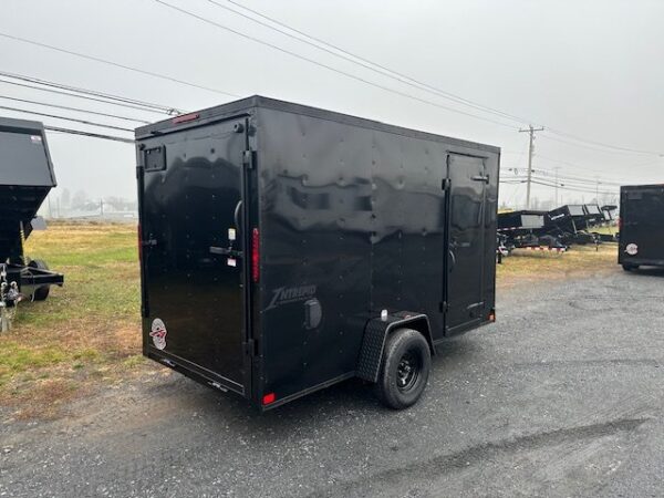 2025-HOMESTEADER-6X12-ENCLOSED-CARGO-TRAILER-RAMP-DOOR-BLACK-TRIM-5.jpg Homesteader 6 x 12 V-Nose Enclosed Trailer – Black Trim