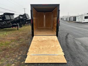 2025-HOMESTEADER-6X12-ENCLOSED-CARGO-TRAILER-RAMP-DOOR-BLACK-TRIM-7.jpg Homesteader 6 x 12 V-Nose Enclosed Trailer – Black Trim