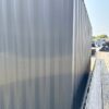 518288731_24084520584536835_7796433739846501905_n.jpg 20ft Used Shipping Container – Matte Black w/ 12’ Side Roll-Up Door