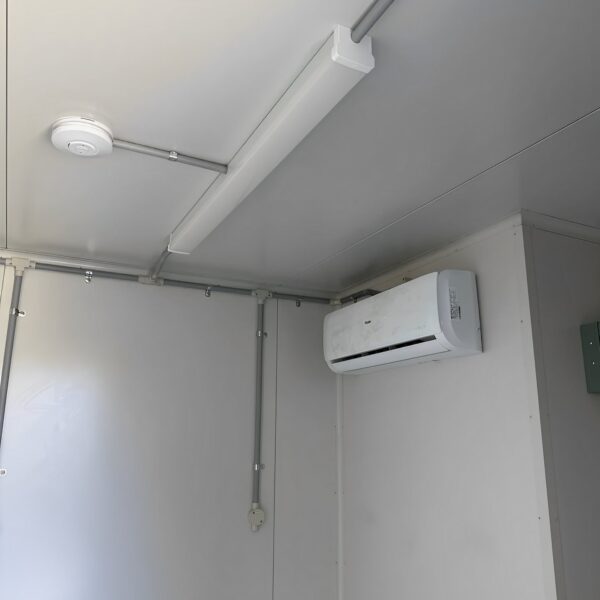White-10′-container-modification-with-AC4.jpg White Modified 10ft Shipping Container with AC